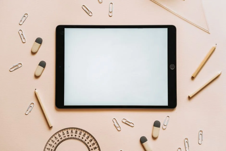 Flat lay of a minimalist brand strategy moodboard on a concrete surface.